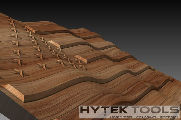 The USA Waving 3D Flag - STL Model by Hytek Tools - Fiber Laser Sales - USA is a wooden carving of an American flag with stars on a rippled surface, ideal for CNC routers. The lower right corner has the Hytek Tools logo and text for laser cutters and accessories on a dark gradient background.