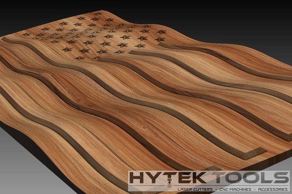 The USA Waving 3D Flag - STL Model by Hytek Tools - Fiber Laser Sales - USA features wavy stripes and carved stars. The sculpture, ideal for CNC router and laser cutter enthusiasts, includes a brand logo at the bottom right and is perfect for detailed design projects.