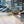 Load image into Gallery viewer, A close-up of a Hytek Tools WeldTEK™ RAYCUS Fiber Laser Welder 1000-3000w torch processing a metal sheet, emitting bright light while cutting or fusing intricate shapes. Similar patterned sheets are visible in the background.