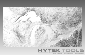 The Great Lakes USA - STL 3D Terrain Model is a grayscale relief map highlighting the lakes and topography, featuring Hytek Tools - Fiber Laser Sales - USA at the bottom. They offer precision laser cutters and CNC routers for intricate designs in .stl format.