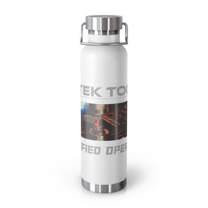 White 22oz insulated water bottle by Printify with a stainless steel lid and base. Features industrial imagery with the text TEK TO and IFIED OPER on the label. Its copper vacuum double-wall design keeps drinks hot or cold longer.