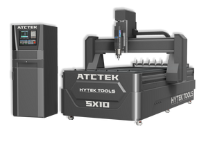 The 2024 ATCTEK™ CNC Industrial Router Machine Pkg by Hytek Tools is a large industrial marvel in gray, with stainless steel elements, sleek black and white accents. Its left-side control panel complements the efficient CNC router featuring auto tool change on the right.