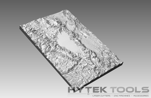 The Tahoe Lake Area 3D Map in .stl format, expertly rendered in grayscale, highlights intricate mountainous terrain with a central flat area and is perfect for CNC routers. The bottom right corner features the Hytek Tools - Fiber Laser Sales - USA logo.