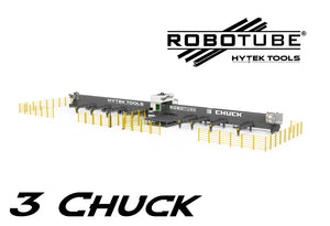 Wide-angle view of a large industrial 3 Chuck - ROBOTUBE™ MODEL RT3 Fiber Laser Metal Tube Cutter by Hytek Tools, surrounded by yellow safety barriers. The ROBOTUBE and Hytek Tools logos are displayed above the machine.