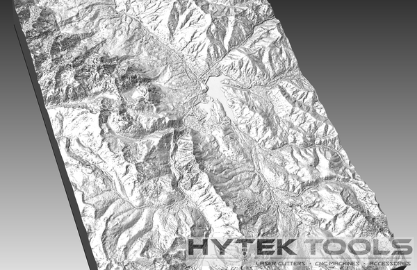 The Frisco Colorado - STL 3D Terrain Model by Hytek Tools - Fiber Laser Sales - USA features a grayscale topographic map of mountain ranges and valleys with detailed textures. In the bottom right, it highlights HYTEK TOOLS, along with LASER CUTTERS, CNC ROUTERS, and ACCESSORIES.
