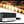 Load image into Gallery viewer, The Hytek Tools 2026 FIBERTEK™ Model DE Fiber Laser 5x10 (2000w-30,000w) emits bright sparks as it precisely cuts jagged sheet metal. Shown below is the machine with a digital display and dual shuttle table.
