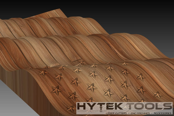 The USA Waving 3D Flag in .stl format from Hytek Tools features an undulating, woven texture with a smooth finish. The lower section displays engraved star-like patterns for CNC Routers, with the Hytek Tools logo at the bottom right.