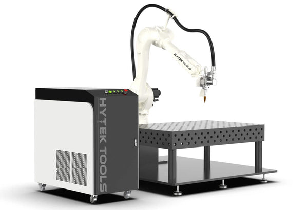 The BOTWELD™ 6 Axis Laser Welder by Hytek Tools features a white robotic arm on a metal perforated table with an IPG fiber laser, connecting to a black and white control unit labeled HYTEK TOOLS, ideal for precision tasks in manufacturing or machining.